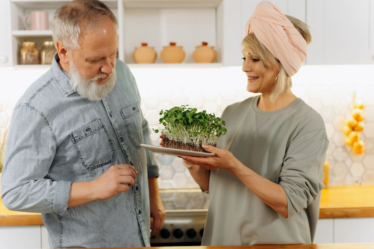 An older couple smiling after reading how to increase fibre intake to support their health