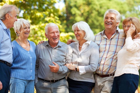 A group of elderly people enjoying time outdoors together